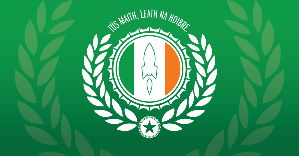 “Tús maith, leath na hoibre.” Proverb on a green background mocked up as an Irish crest with a rocket in the center.