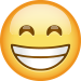 Emoji of yellow smiley face with squinty eyes and teeth showing in a full smile.
